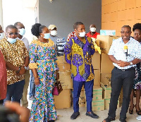 Deputy Health Minister, Alexander K. Abban taking receipt of the items