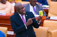 MP for Ofoase Ayirebi, Kojo Oppong Nkrumah displaying the well-packaged juice