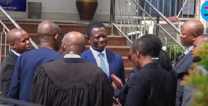 Dr. Stephen Opuni former CEO of COCOBOARD surrounded by his legal team