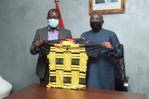 Dr. Bawumia displays a Black Stars jersey with GFA President, Kurt Okraku