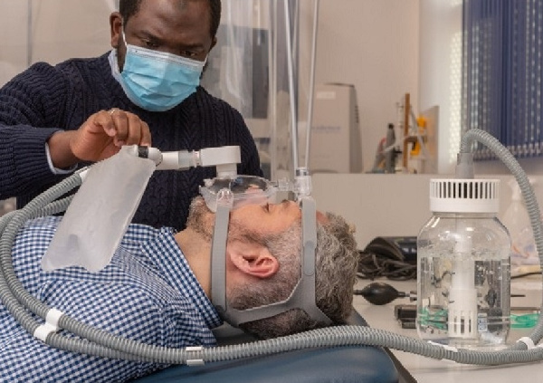 Yusuf Bilesanmi shows how his invention works. Photo credit: Loughborough University