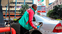 Customer attendant at Rubis Petroleum Station on Koinange Street, Nairobi County, Kenya