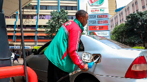 Customer attendant at Rubis Petroleum Station on Koinange Street, Nairobi County, Kenya