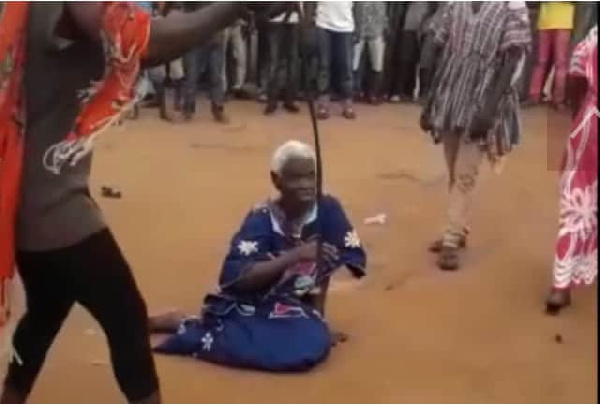 A photo of the 90-year-old woman, Madam Dente Akua on the floor