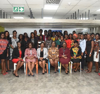 The speakers in a group photo with the participants