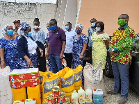 The Women's Ministry presenting the items to the officials at Nsawam Prison