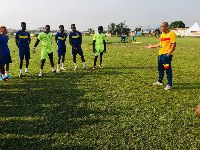 Players of Accra Hearts of Oak with their coach during training