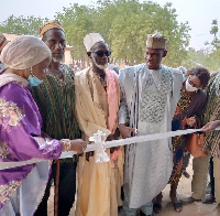 Mr Iddrisu (in kaftan) assisted by other dignitaries to inaugurate the facility