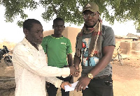 Blind farmer receiving donation