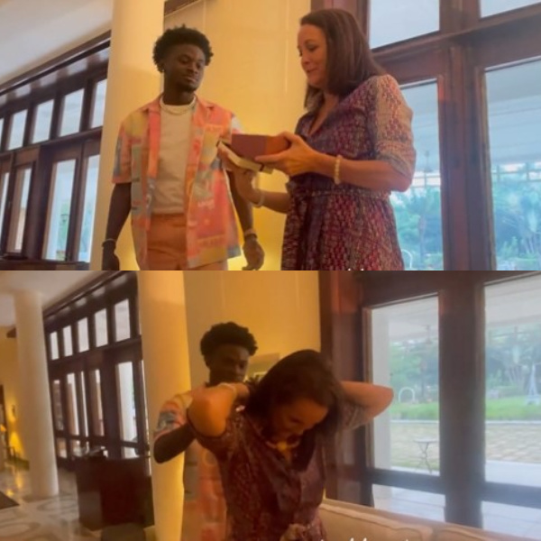 Anne Sophie receiving gift from Kuami Eugene