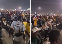 Fans of the Black Stars dance in celebration of Uruguay's loss