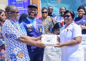 President of the Rotary Club of Accra-East, Serge Sourou Oga presenting thermal coagulators