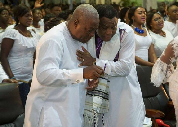 Former President John Mahama (L) in a t