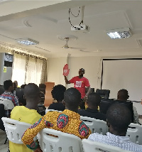 Samuel Agbotsey, National Campaign Coordinator of AI Ghana speaking to HRRG members