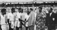 Black Stars' Dogo Moro receiving a pre-match handshake before a Black Stars