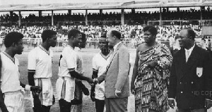 Black Stars' Dogo Moro receiving a pre-match handshake before a Black Stars