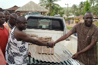 File Photo: A rep from the Assembly making the donation