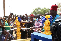 Minister of Transport, Kwaku Ofori Asiamah (middle), cuts ribbon during commissioning event