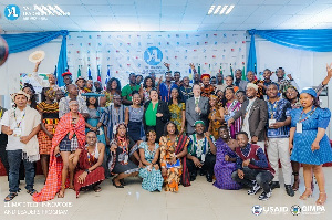 A group picture of participants and guest speakers at the event