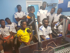 Players of Star Madrid inside the studio of Zylofon FM