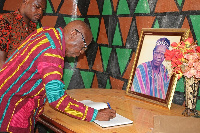 Mahami Salifu signing the book of condolence