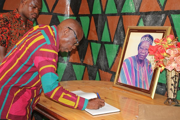 Mahami Salifu signing the book of condolence