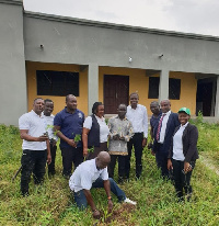 Samuel Ben Amoo with some of the staff of the District Magistrate Court in Saltpond, Cape Coast