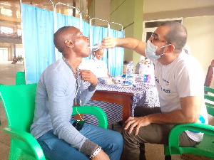 Dentist Examining Patient