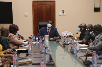 Dr. Yaw Osei Adutwum in a meeting with his staff