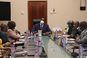 Dr. Yaw Osei Adutwum in a meeting with his staff