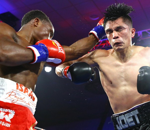 Isaac Dogboe lands a punch on Joet Gonzalez