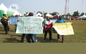 Some of the workers protesting with placards