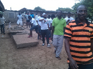 Trigmatic [in white cap] and his team inspecting the site