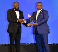 Hanan being decorated by H.E President Julius Maada Bio of Sierra Leone