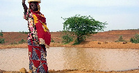 A woman getting water from a pond infected with cholera