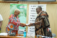 Nana Otuo Siriboe presenting the donation to Rev. Dr. Joyce Aryee