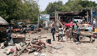 Agitated traders around the president's house park their wares to avoid forceful eviction