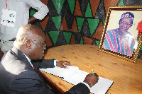 Joseph Kofi Adda, MP for Navrongo Central signing late Tedam's book of condolence