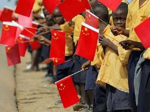 African school children waving the Chinese flag