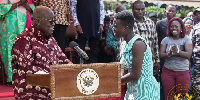 President Nana Addo Dankwa Akufo-Addo interacting with a beneficiary of the Free SHS policy