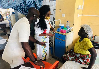 Nana Asante Bediatuo and wife interacting with a patient