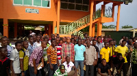 Mr Samuel Okudzeto Ablakwa in a pose with some of the players