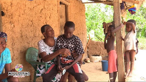 Emmanuel with his grandmother