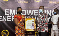 Mr. Francis Owusu-Akyaw receiving his citation from a member of the Youth Awards Ghana (YAG)