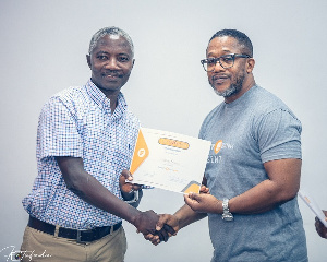 David Okyere, Head Of Agency Banking Presents Certificate To Patrick Amankwah Arthur0.jpeg