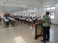 Municipal Director of the Akatsi South Directorate of the NCCE, Rev. Vincent Adzika speaking