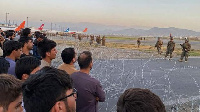 American sojas as dem dey patrol di Kabul airport