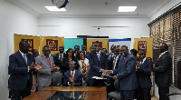 Officials of GN Savings and Ecobank Ghana in a group photograph after signing the agreement