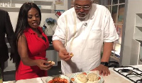 Former President Rawlings enjoying meal of kenkey and fish with Nana Aba