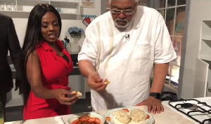 Former President Rawlings enjoying meal of kenkey and fish with Nana Aba